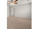Spacious carpeted bedroom with ceiling fan and neutral walls at 12029 Conrad Circle, Hampton, GA 30228