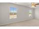 Well-lit bedroom with carpeted floors and large windows at 12029 Conrad Circle, Hampton, GA 30228