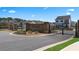 Shoal Creek community entrance with brick pillars and wrought iron gates at 12029 Conrad Circle, Hampton, GA 30228