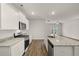 Modern kitchen featuring granite countertops and stainless steel appliances at 12029 Conrad Circle, Hampton, GA 30228