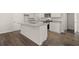 Modern kitchen with granite counters, hardwood floors, and white cabinets at 12029 Conrad Circle, Hampton, GA 30228