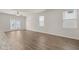 Open living area with hardwood floors, doors to patio, and ceiling fan at 12029 Conrad Circle, Hampton, GA 30228