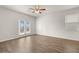 Living room with hardwood floors and access to back deck at 12029 Conrad Circle, Hampton, GA 30228