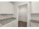 Walk-in pantry with wire shelving and white cabinets at 12029 Conrad Circle, Hampton, GA 30228
