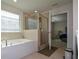Bathroom with garden tub, shower, and bedroom view at 129 Warbler Way, Mcdonough, GA 30253