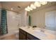 Bathroom with shower, double vanity, and linen closet at 129 Warbler Way, Mcdonough, GA 30253