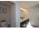 Double vanity bathroom with toilet and linen closet at 129 Warbler Way, Mcdonough, GA 30253