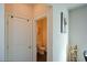 Small powder room with toilet and dark wood flooring at 129 Warbler Way, Mcdonough, GA 30253