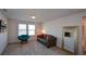 Upstairs bedroom with a sofa, chair, and large mirror at 129 Warbler Way, Mcdonough, GA 30253