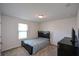 Bedroom with double bed, TV, and ample closet space at 129 Warbler Way, Mcdonough, GA 30253