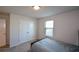 Bright bedroom with double bed and window at 129 Warbler Way, Mcdonough, GA 30253