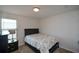 Cozy bedroom with double bed and nightstand at 129 Warbler Way, Mcdonough, GA 30253