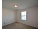 Spacious bedroom with large window and closet at 129 Warbler Way, Mcdonough, GA 30253