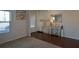 Bright foyer with hardwood floors, a console table, and a view into the living room at 129 Warbler Way, Mcdonough, GA 30253