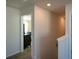 Upstairs hallway with access to bedroom and stairs at 129 Warbler Way, Mcdonough, GA 30253