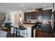 Modern kitchen with granite countertops and stainless steel appliances at 129 Warbler Way, Mcdonough, GA 30253
