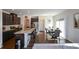 Modern kitchen with dark cabinets, granite counters, and stainless steel appliances at 129 Warbler Way, Mcdonough, GA 30253