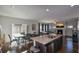Open concept kitchen and dining area with hardwood floors at 129 Warbler Way, Mcdonough, GA 30253