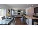 Open concept kitchen and Gathering room with hardwood floors and fireplace at 129 Warbler Way, Mcdonough, GA 30253