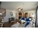L-shaped living room with hardwood floors and view into kitchen at 129 Warbler Way, Mcdonough, GA 30253