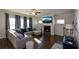 Spacious living room featuring a cozy fireplace and sectional sofa at 129 Warbler Way, Mcdonough, GA 30253