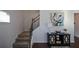 Elegant staircase with dark wood railing and neutral wall at 129 Warbler Way, Mcdonough, GA 30253