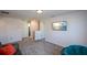 Upstairs hallway with carpet, a couch and a view into a bathroom at 129 Warbler Way, Mcdonough, GA 30253