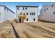 Exterior of new construction home with a small wood deck and a graded backyard at 31 Bennett Farm Dr, Loganville, GA 30052