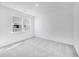 A bedroom with neutral colored walls, white trim, and a window for natural light at 31 Bennett Farm Dr, Loganville, GA 30052