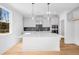 Bright kitchen featuring a center island with stainless steel appliances and stylish backsplash at 31 Bennett Farm Dr, Loganville, GA 30052
