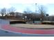 Community street view showing landscaping, circular fountain, and nearby buildings at 3857 Felton Hill Sw Rd # 9, Smyrna, GA 30082