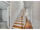 Classic staircase with hardwood treads and white risers at 72 Waddell Ne St, Atlanta, GA 30307