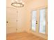 Dining room featuring modern light fixture, white walls, and sliding glass door to the outside at 2414 Rose Palm Pl, Atlanta, GA 30315