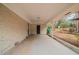 Covered back patio with concrete flooring and exterior access at 2476 Brentford Pl, Decatur, GA 30032