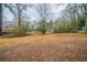 Large backyard with mature trees and open space at 2476 Brentford Pl, Decatur, GA 30032
