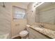 Updated bathroom with a bathtub and granite countertop at 2476 Brentford Pl, Decatur, GA 30032