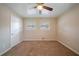 Bedroom with ceiling fan, neutral walls, and brown carpet at 2476 Brentford Pl, Decatur, GA 30032