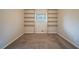 Spacious bedroom with built-in shelving and carpet at 2476 Brentford Pl, Decatur, GA 30032