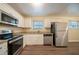 Kitchen with stainless steel appliances and granite countertops at 2476 Brentford Pl, Decatur, GA 30032