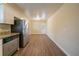 Eat-in kitchen with stainless steel appliances and light wood floors at 2476 Brentford Pl, Decatur, GA 30032