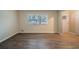 Living room with wood-look floors and neutral walls at 2476 Brentford Pl, Decatur, GA 30032