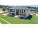 Luxury home with a patio and balcony, seen from above at 553 Versailles Dr, Auburn, GA 30011