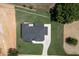 Modern home with a large backyard and driveway, seen from above at 553 Versailles Dr, Auburn, GA 30011