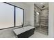 Spa-like bathroom with soaking tub and walk-in shower at 553 Versailles Dr, Auburn, GA 30011