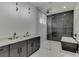 Modern bathroom with double vanity, large shower, and soaking tub at 553 Versailles Dr, Auburn, GA 30011