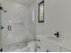 Bathroom with walk-in shower and modern vanity at 553 Versailles Dr, Auburn, GA 30011