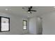 Modern bedroom with geometric wall details and ceiling fan at 553 Versailles Dr, Auburn, GA 30011