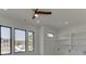 Bright bedroom with built-in shelving and a ceiling fan at 553 Versailles Dr, Auburn, GA 30011