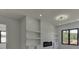 Bedroom with built-in shelving, fireplace, and large windows at 553 Versailles Dr, Auburn, GA 30011