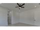 Light and airy bedroom with ceiling fan and access to bathroom at 553 Versailles Dr, Auburn, GA 30011